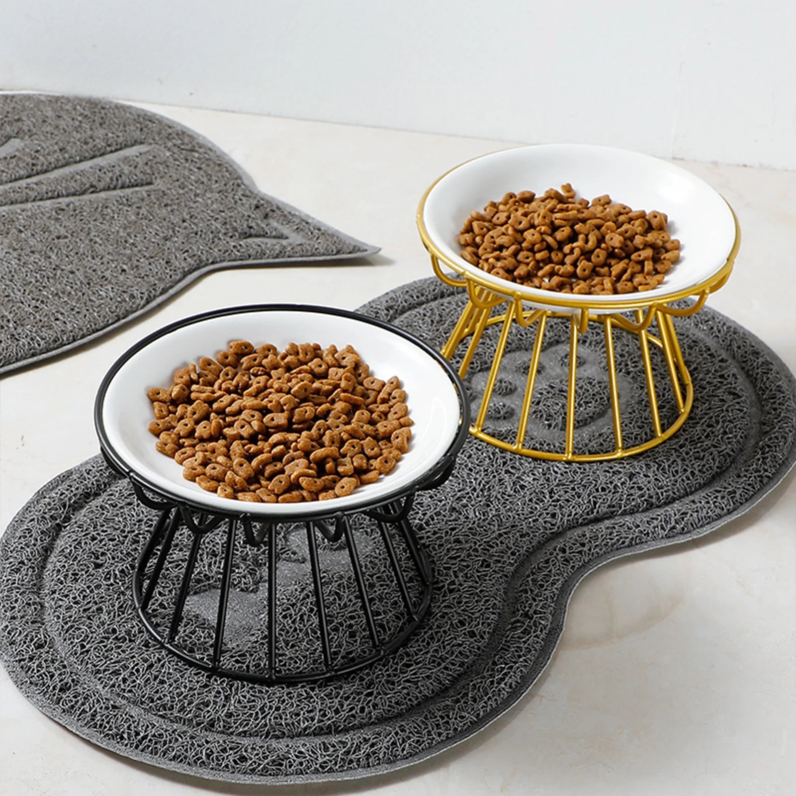 Ceramic Elevated Pet Bowl with Stand Food & Water Two elevated pet bowls filled with kibble on a textured mat.
