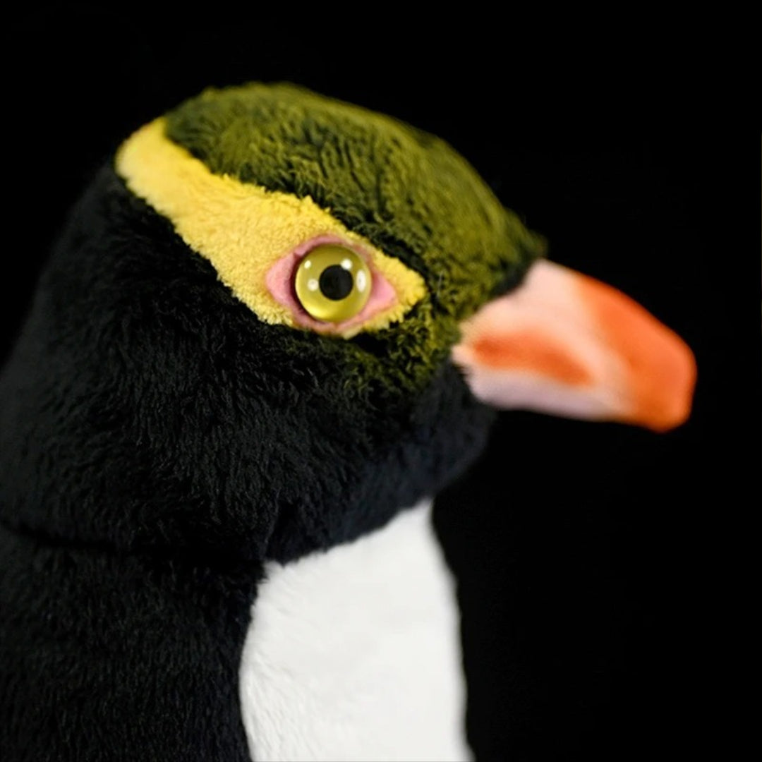 Realistic Penguin Plush Toy - Adélie Penguin Stuffed Animal Close-up of a plush penguin toy with a black background