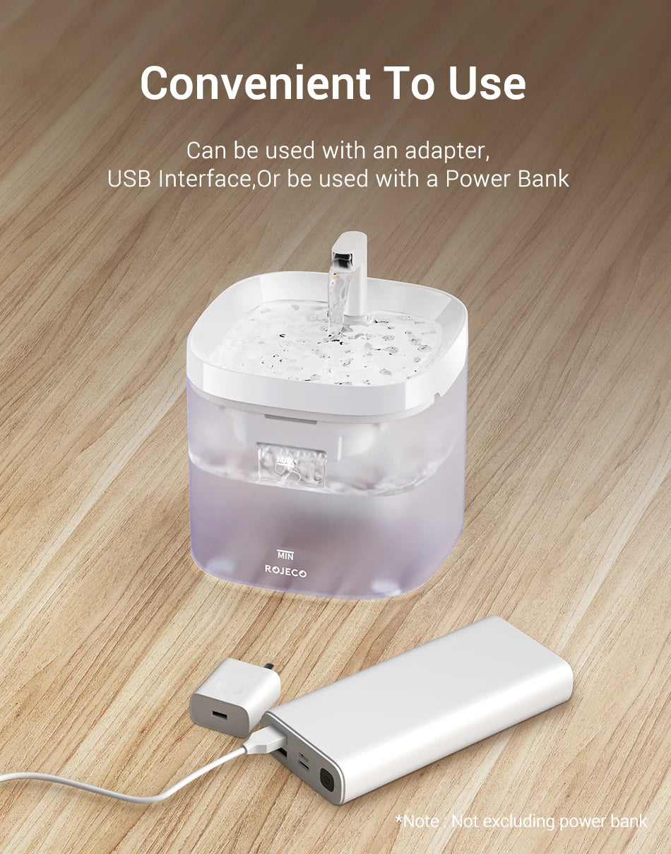 Smart Cat Water Fountain Automatic Filter Pet Dispenser Transparent adapter with USB interface and power bank on a wooden surface