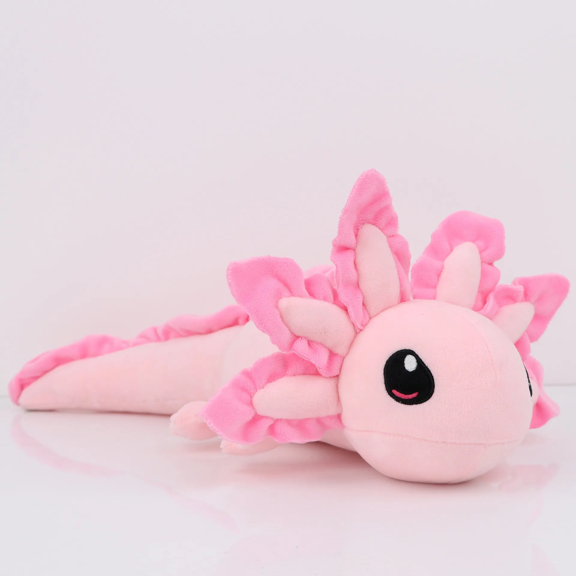 Axolotl Squishmallow Plush Toy – Soft Stuffed Animal Pink axolotl plush toy on a light pink background
