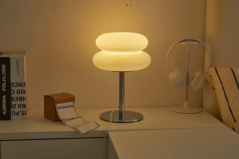 Orange Mushroom Bedside Table Lamp – USB Tri-Color Dimmable Light Table lamp on a surface with books and headphones in the background