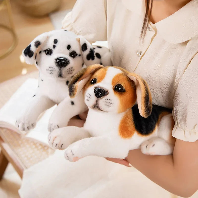 Realistic Dalmatian Beagle Plush Stuffed Toy Two plush dog toys, one Dalmatian and one Beagle, held by a person.