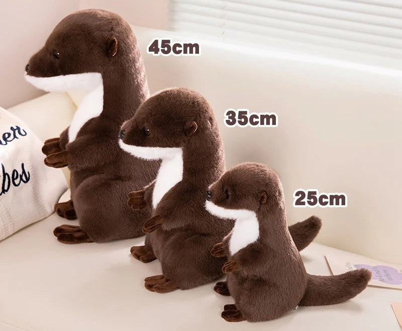 Realistic Otter Plush Toy Four plush otters of different sizes on a light surface with measurements indicated.