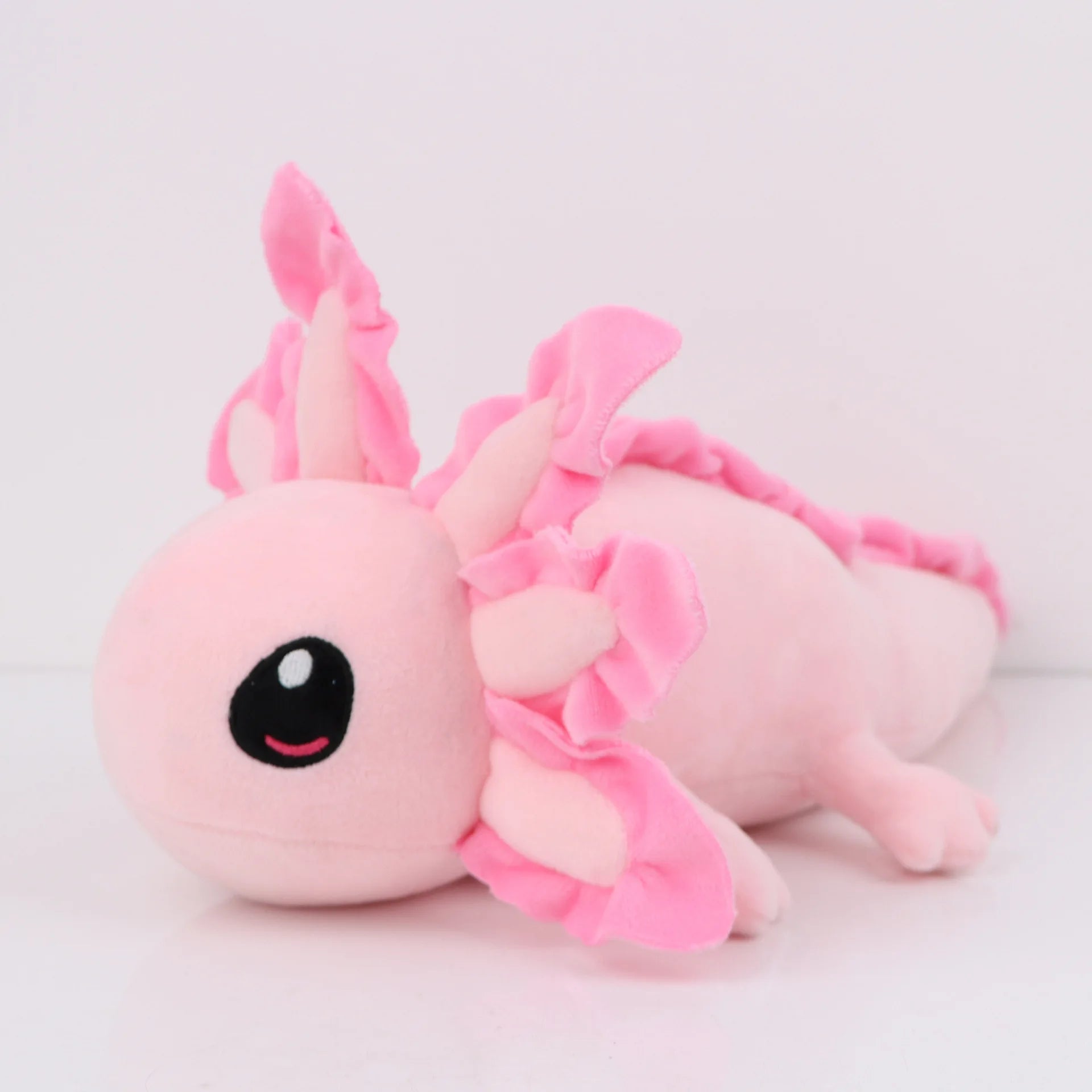 Axolotl Squishmallow Plush Toy – Soft Stuffed Animal Pink axolotl plush toy on a light gray background