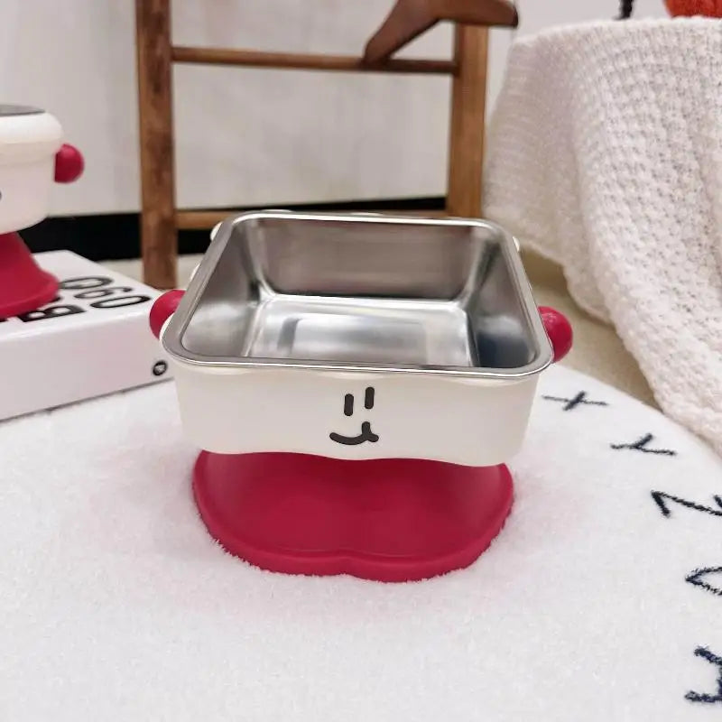 Elevated Pet Bowl Stainless Steel Anti-Slip Feeding Dish Metallic food container with red base and smiley face design on a white surface.