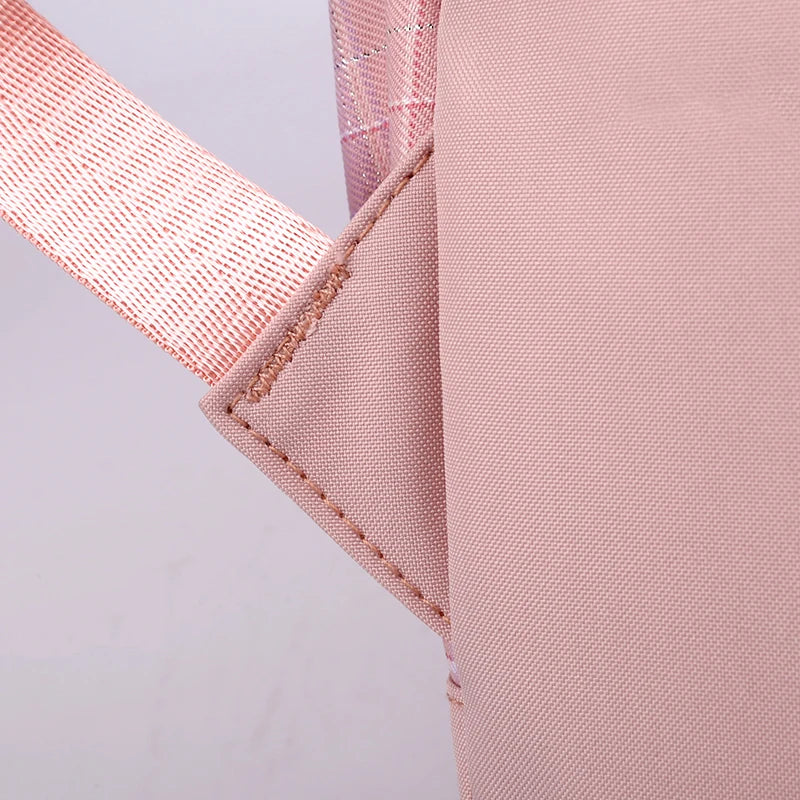 Capybara Bubble Tea Backpack – School Bag for Teens Close-up detail of a light pink fabric item with a matching pink woven strap and stitched seam on a pale background.