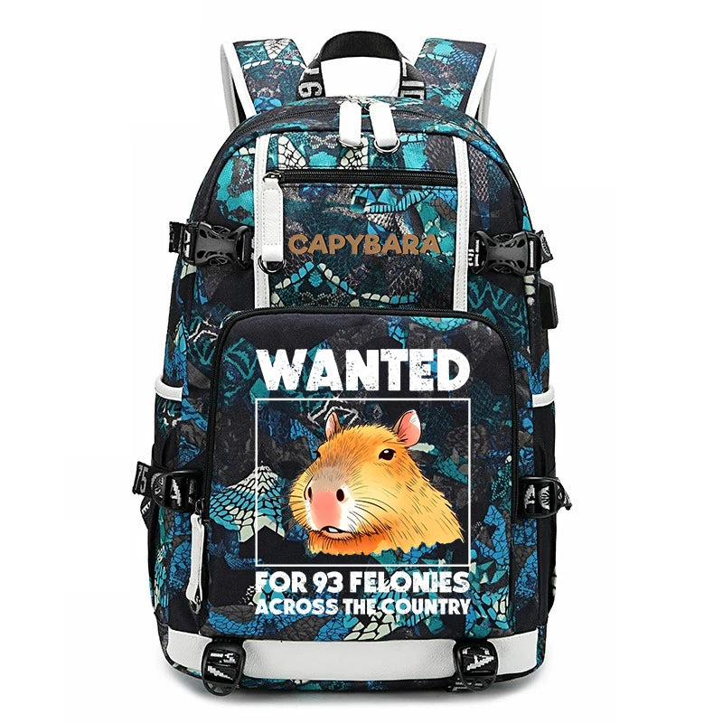 Capybara Backpack – Large Capacity Lightweight School Bag A patterned backpack with a large front graphic featuring a cartoon capybara and the text 'WANTED FOR 93 FELONIES ACROSS THE COUNTRY.' The backpack has multiple compartments, padded shoulder straps, and side buckles.