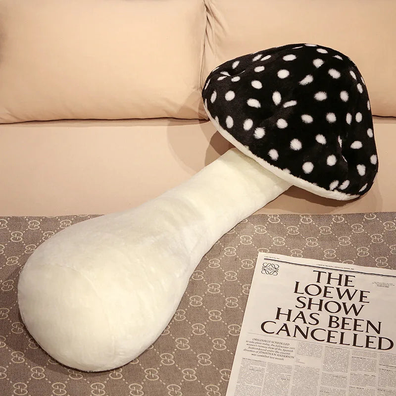 Large Mushroom Plush Pillow – Soft Huggable Stuffed Plant Cushion Plush mushroom toy on a patterned surface with a newspaper underneath