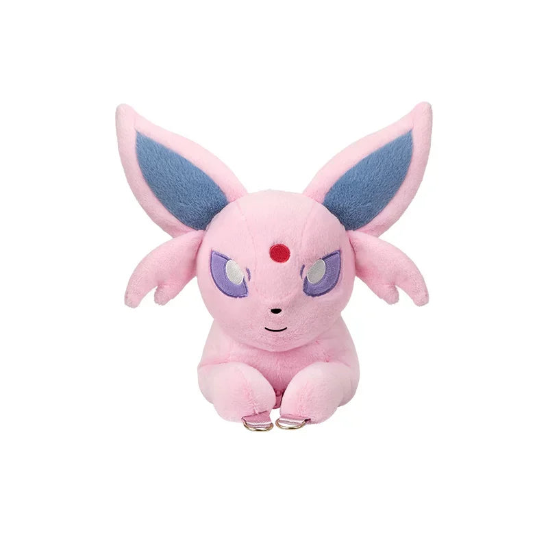 Pokemon Eevee Evolution Plush Crossbody Bag A pink plush toy of a cute, fox-like Pokémon character with large blue-tinted ears and purple eyes, sitting against a plain white background.