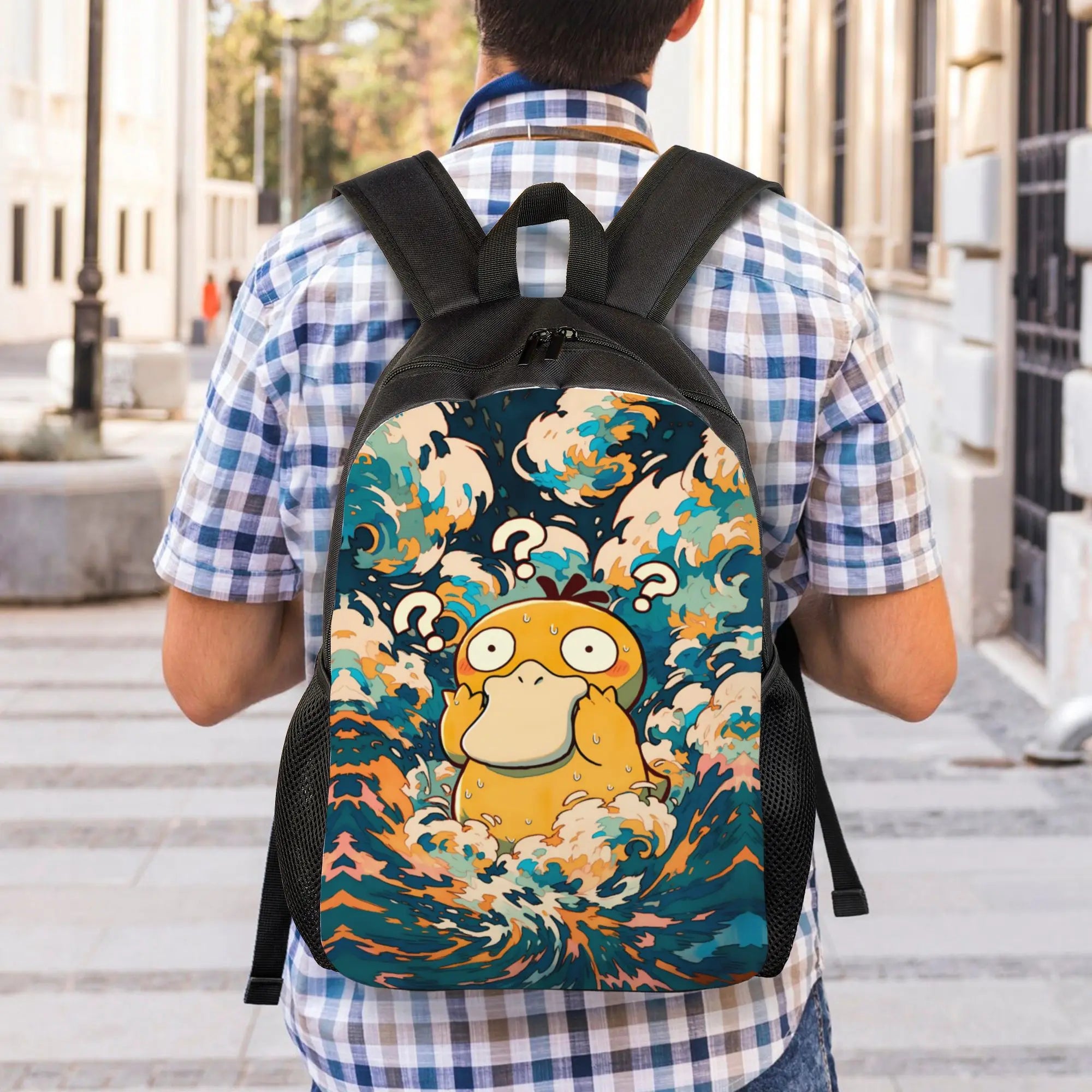 Pokemon Psyduck Laptop Backpack – School Bag A person viewed from behind wearing a blue and white checkered shirt and carrying a black backpack with a colorful graphic print of a yellow cartoon character in a wave scene.