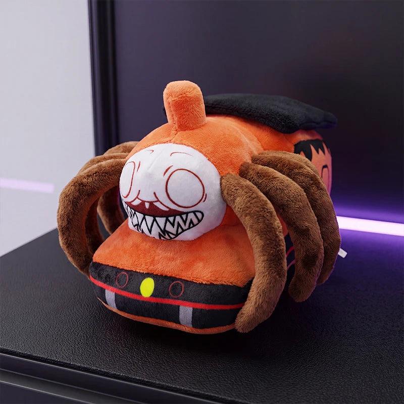 Horror Spider Plush Dolls – 2-Piece Creepy Halloween Set An orange plush toy shaped like a spider with a cartoon face, sitting on a black surface with a dark background and purple ambient lighting.