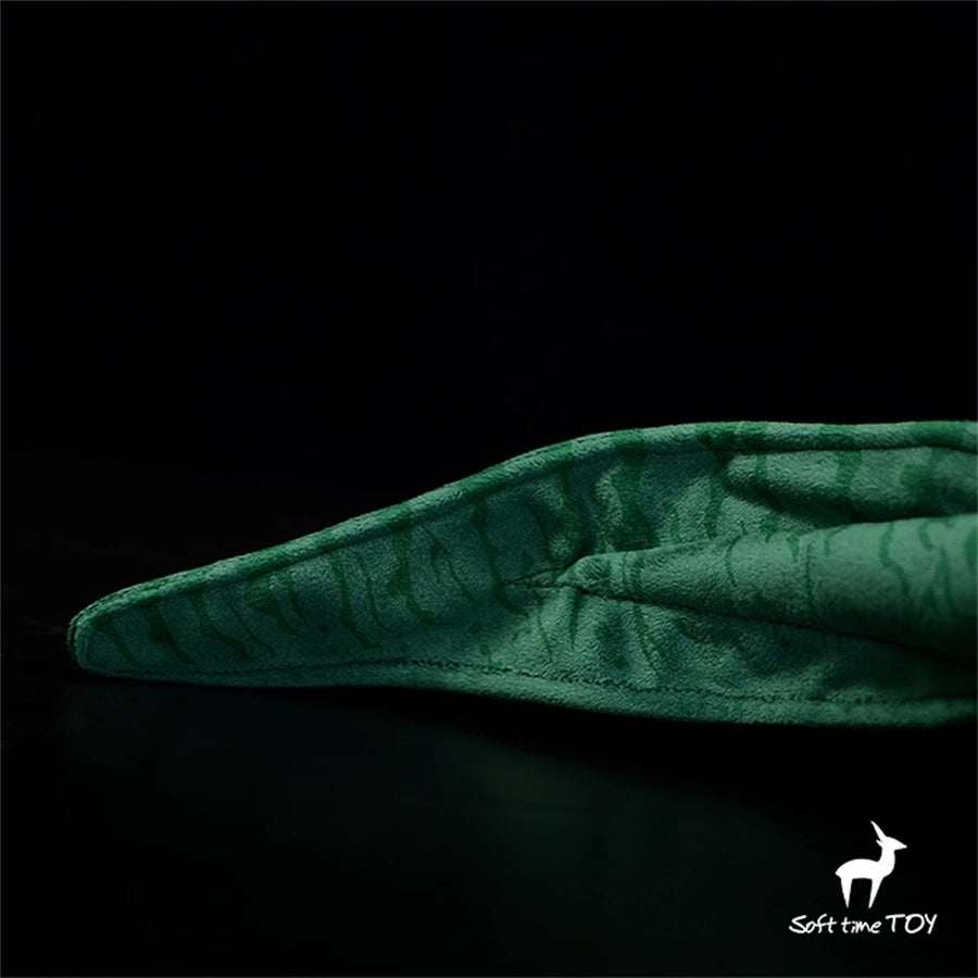 Realistic Axolotl Hammerhead Salamander Stuffed Toy - Diplocaulus Plushie Green textured object on a black background with Soft Time Toy logo.