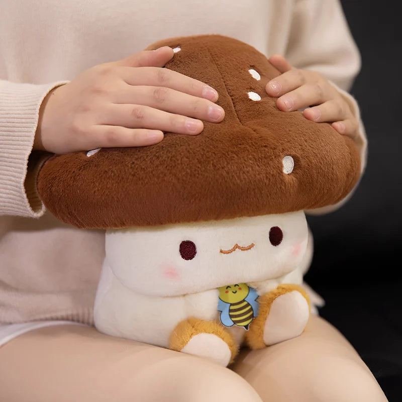 Creative Mushroom Plush Pillow – Cute Stuffed Plant Cushion for Home Décor Plush toy shaped like a mushroom with a bee on a dark background
