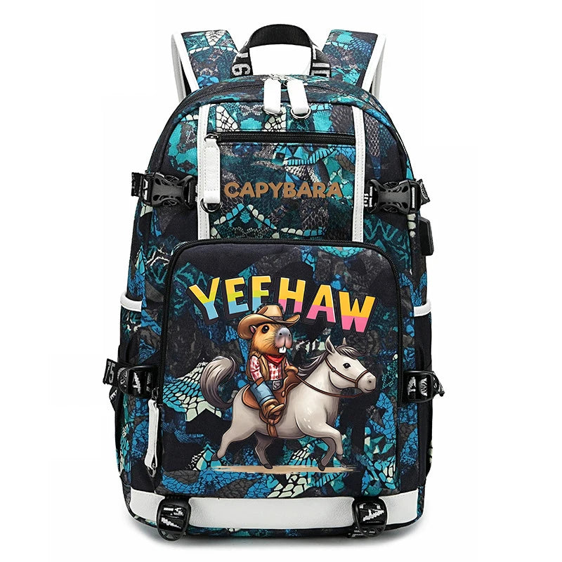 Capybara Backpack – Large Capacity Lightweight School Bag A black and blue patterned backpack with a cartoon graphic of a cowboy riding a white horse on the front pocket, featuring the text 'YEEHAW' in colorful letters and 'CadyBara' printed near the top.