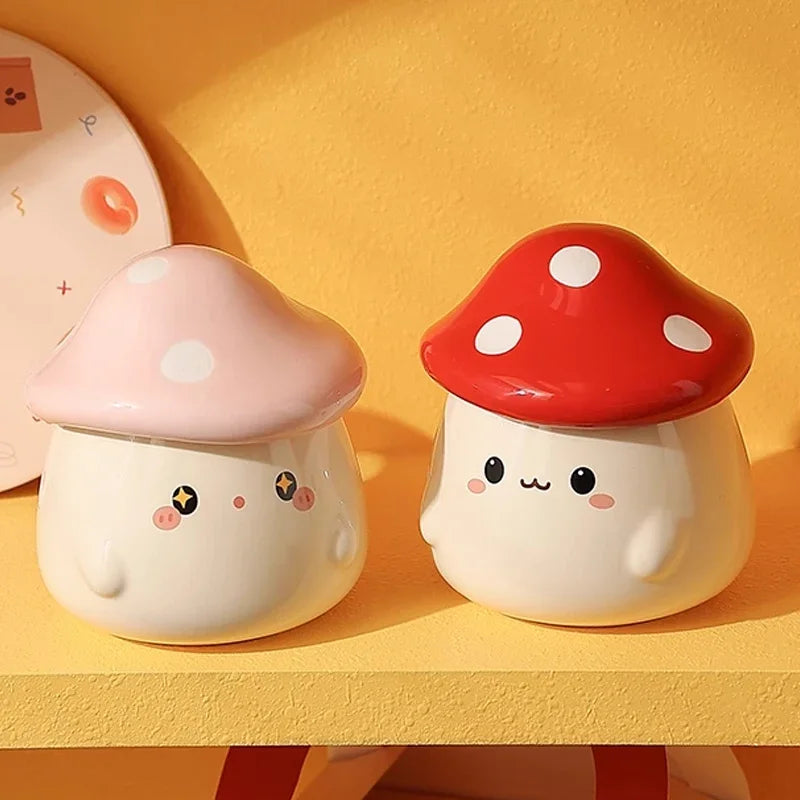 Cute Mushroom Coffee Mug with Lid – 400ML Ceramic Cup Two cute mushroom-shaped containers with faces on a yellow background