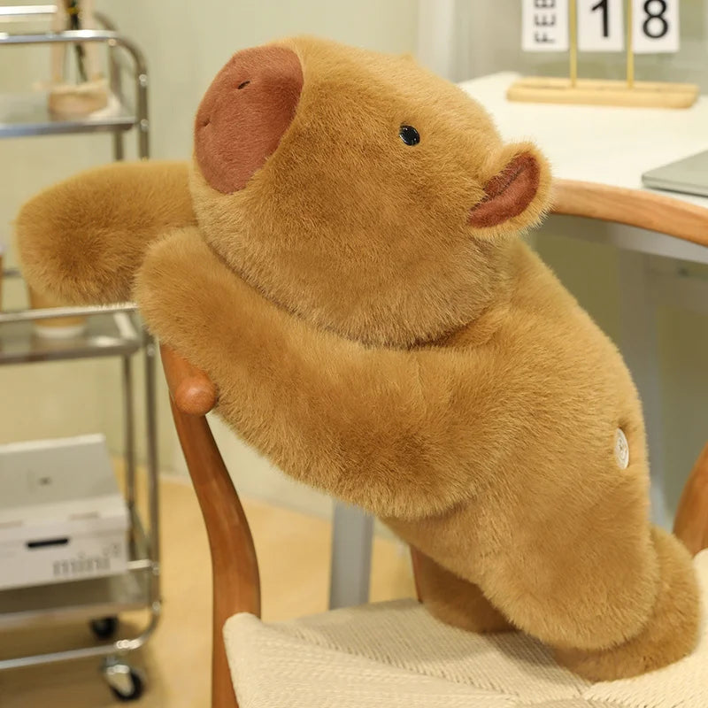 Weighted Capybara Plush Pillow – Soft Stuffed Animal Brown teddy bear sitting on a chair in an indoor setting