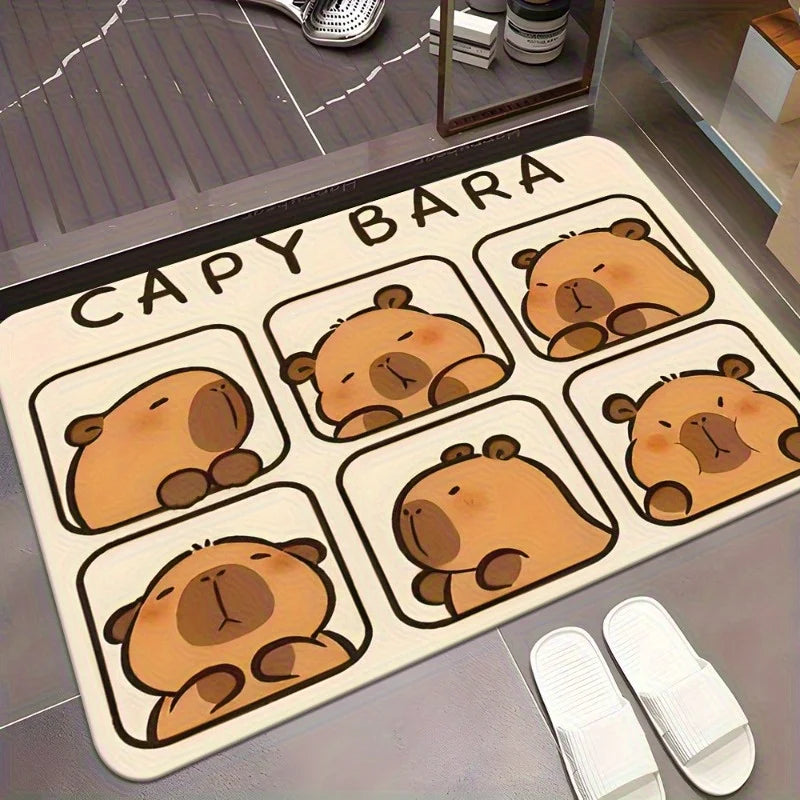 Capybara Doormat – Soft Flannel Non-Slip Indoor & Outdoor Rug A rectangular bathroom or entryway mat with a cartoon capybara design and the text 'CAPY BARA' printed on it, shown on a gray floor next to white slippers.