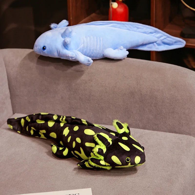Cute Axolotl Plush Toy – Squishmallow Salamander Stuffed Animal Two plush axolotls, one blue and one black with yellow spots, on a brown surface.