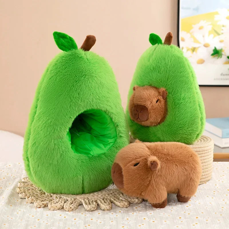 Avocado Capybara Plush Toy – Cute Soft Pillow Two plush avocado-shaped pet beds with small brown plush animals on a light surface.