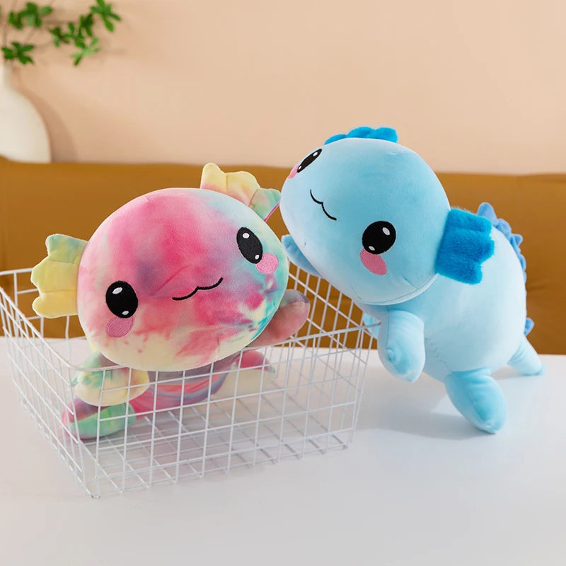Axolotl Squishmallow Plush – Stuffed Animal Toy Two colorful plush toys, one pink and one blue, on a white surface with a neutral background.