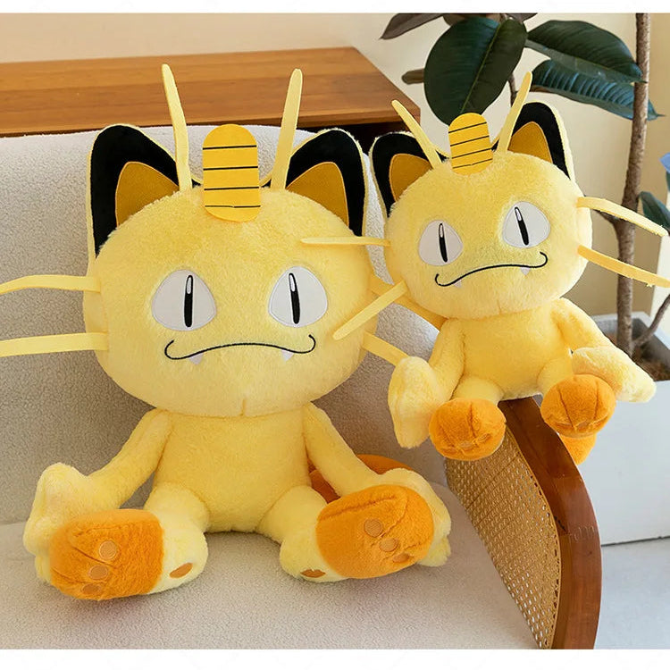 Pokemon Meowth Plush Toy – Giant Cute Stuffed Animal Pillow Two yellow plush toys with black accents on a couch