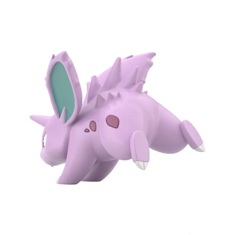 Pokemon Nidoking, Nidorino & Nidoran Shokugan Figure Set A small purple cartoon creature figurine with a teal inner ear and pink spots, shown on a plain white background. A round Banprey logo appears in the lower right corner.