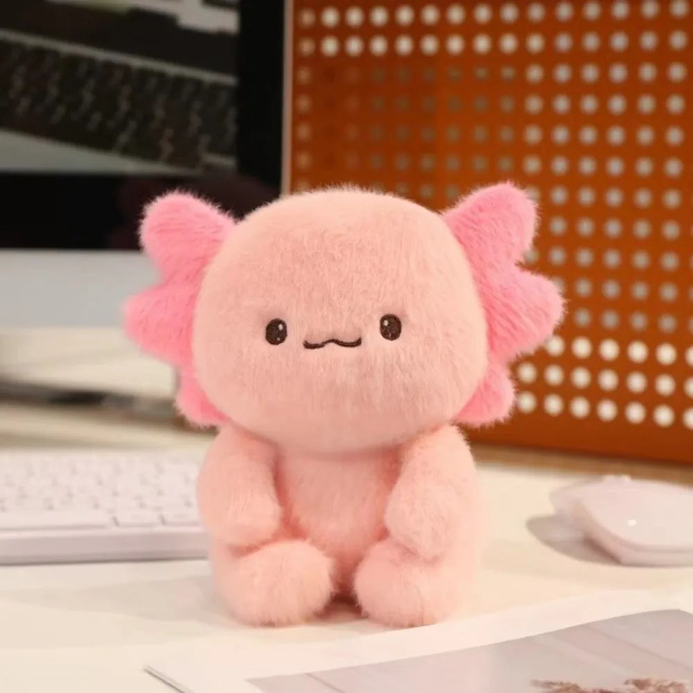 Axolotl Plush Toy – Squishmallow Salamander Stuffed Animal Pink plush toy with flower-like ears on a desk