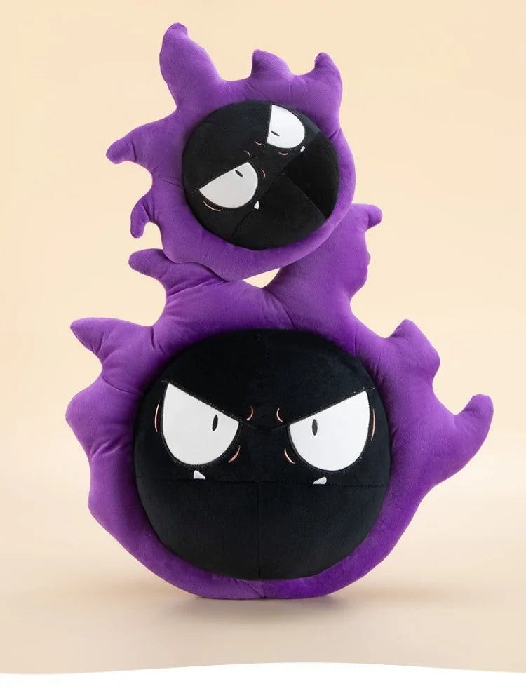 Pokemon Gastly Plush Pillow Stuffed Toy A plush toy shaped like a stacked pair of purple Ghost-type characters with angry white eyes and black faces, photographed against a plain warm beige background.