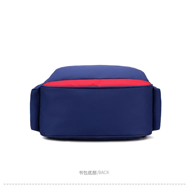 Pokemon Cartoon Backpack – Large Capacity School Bag A navy blue backpack shown from the back, featuring a bright red horizontal stripe across the upper portion, photographed on a clean white background with Chinese text '书包底部/BACK' below.