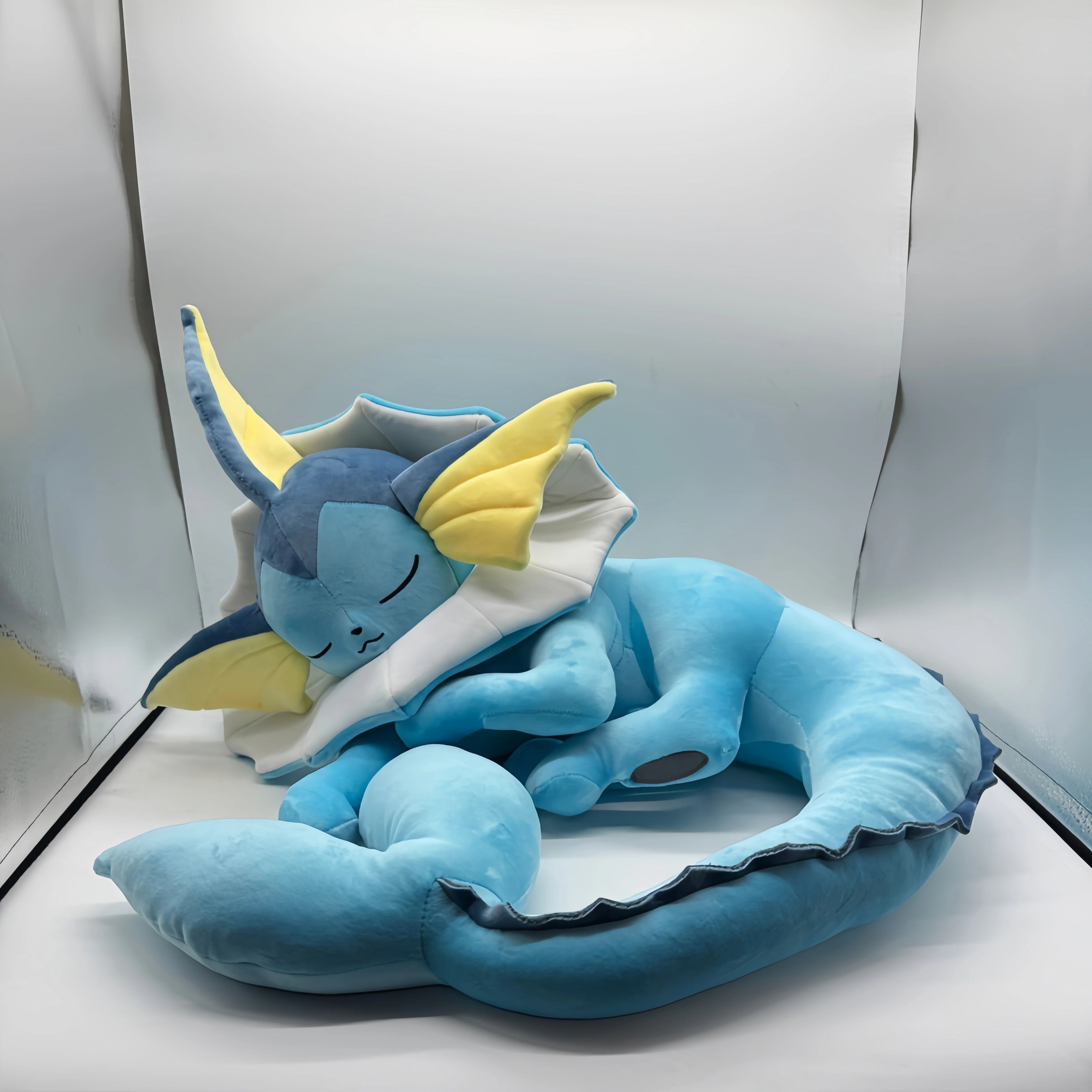 Pokemon Eevee Plush Toy Vaporeon Stuffed Animal Blue plush toy with yellow accents on a white background