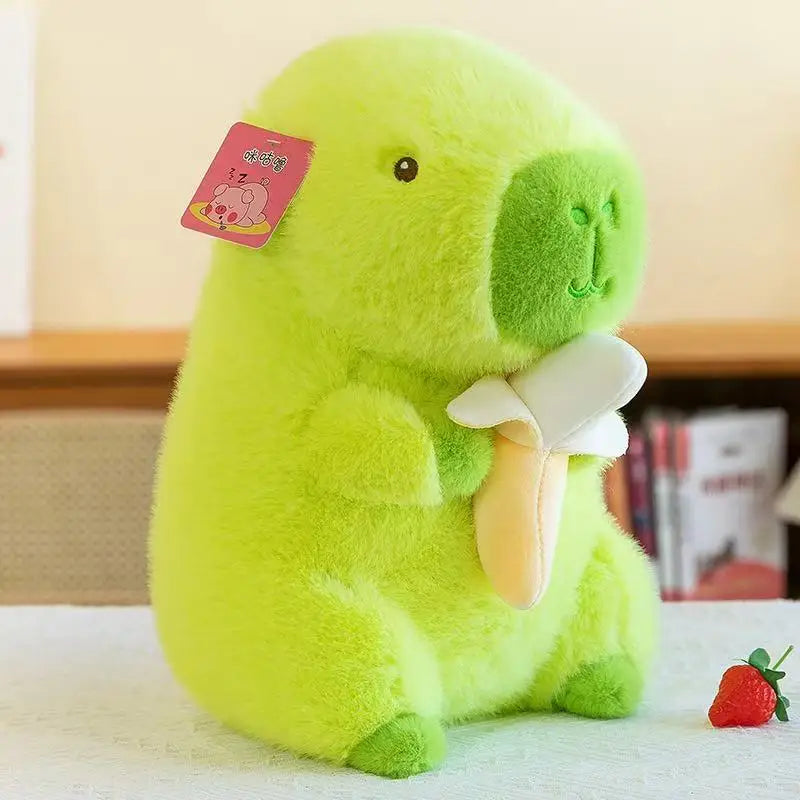 Green Banana Capybara Plush Toy – Cute Kawaii Stuffed Animal Green plush toy with a strawberry on a light background