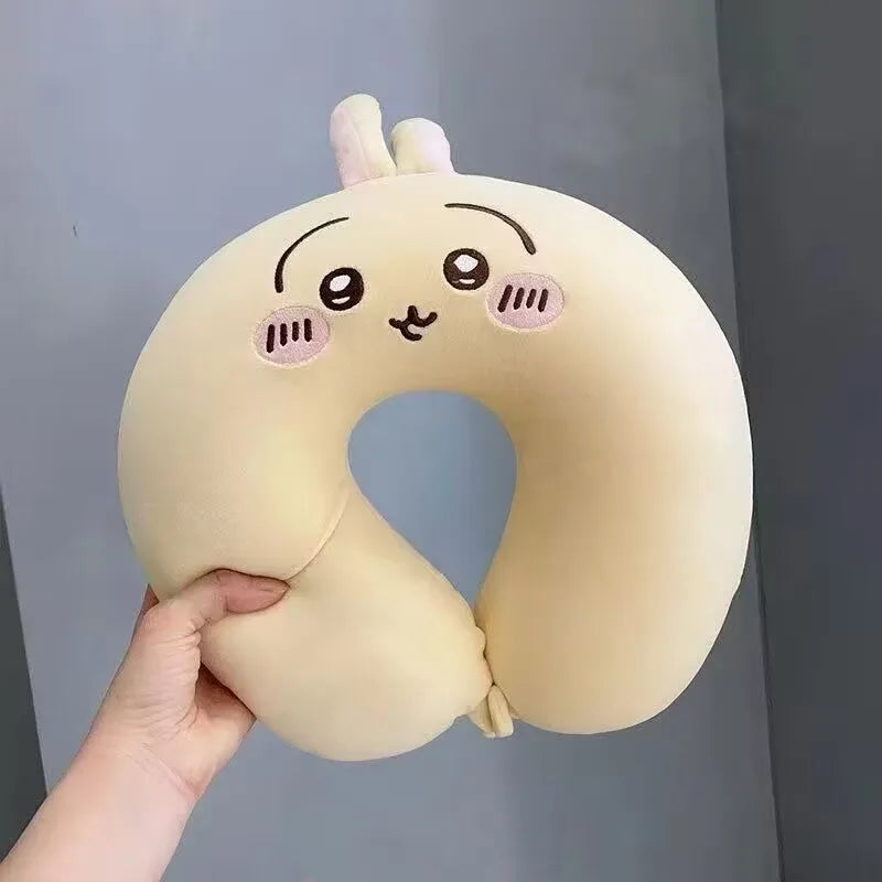 Cute Capybara U-Shaped Neck Pillow – Plush Travel Pillow Beige neck pillow with cartoon face held by a hand against a gray background