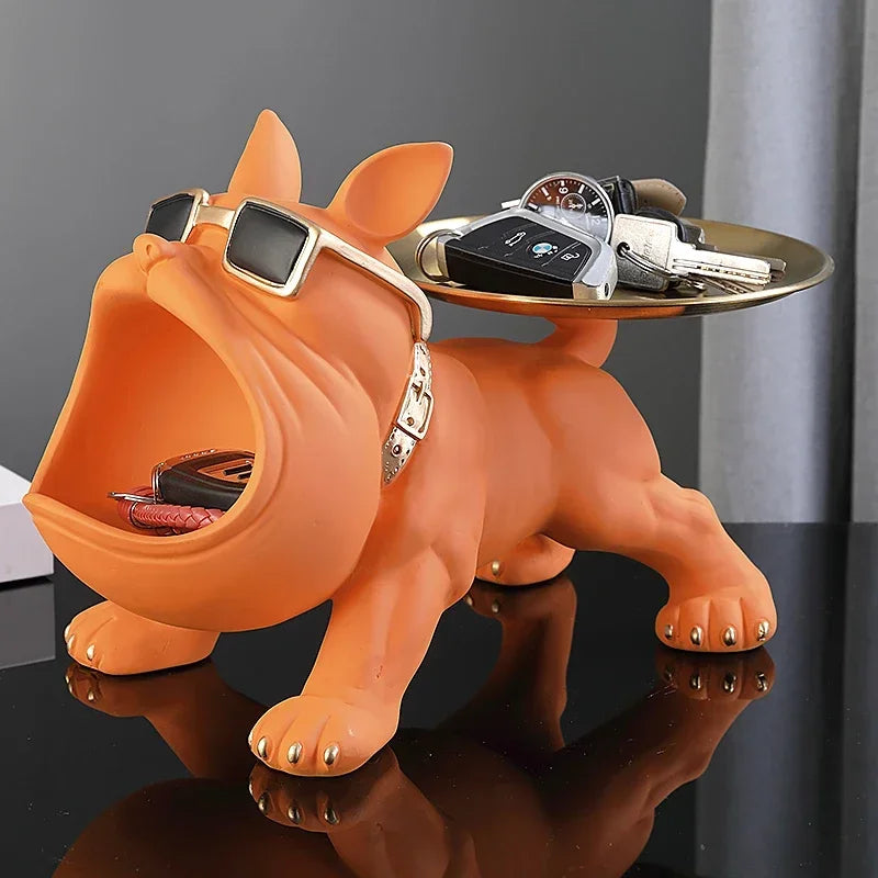 Bulldog Figurine with Storage Box – Resin Dog Home Decor Sculpture Orange bulldog-shaped key holder with a tray on a dark surface
