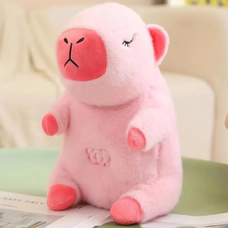 Breathing Otter & Capybara Plush with Light & Sound Pink plush toy with a simple face on a light background