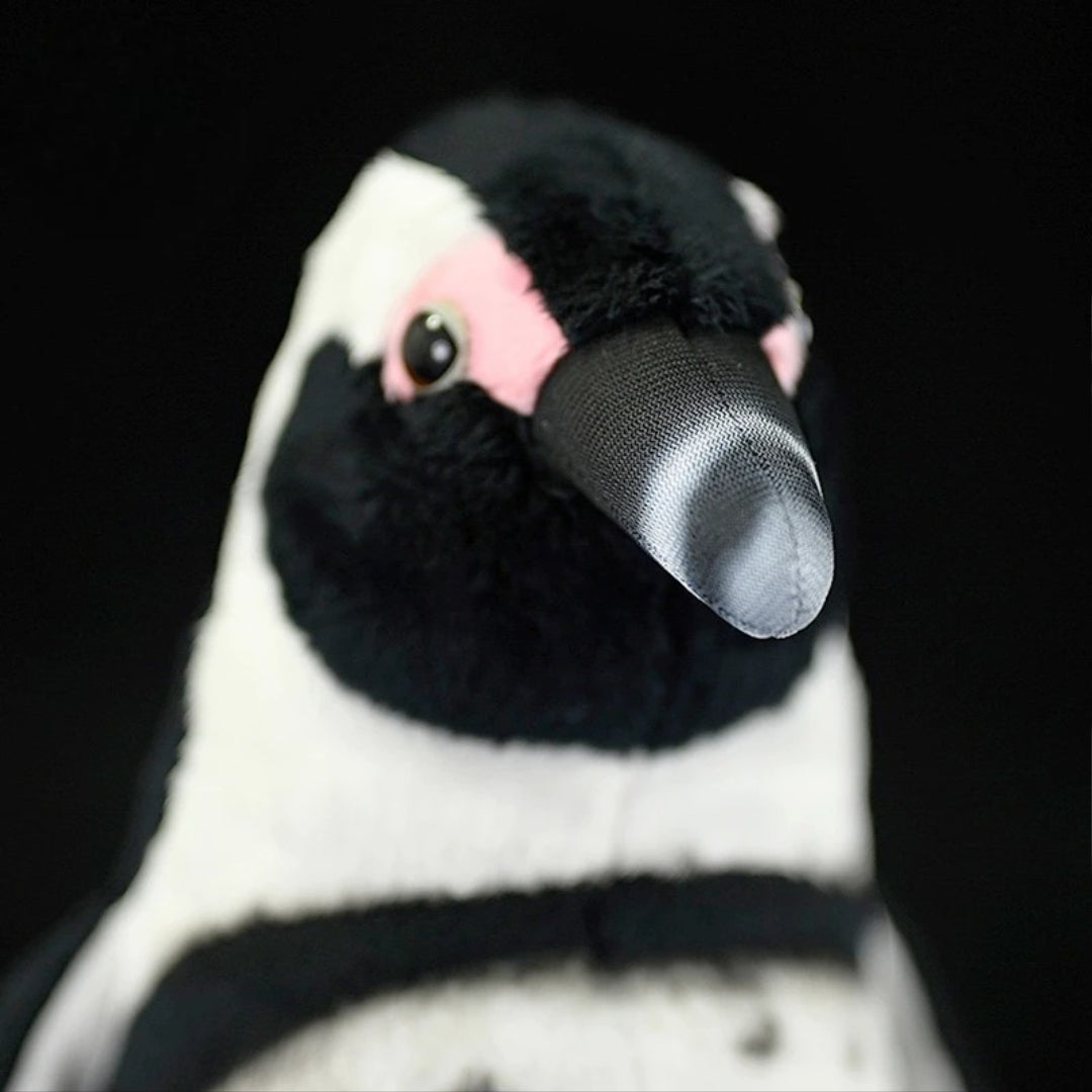 Realistic Penguin Plush Toy - Adélie Penguin Stuffed Animal Close-up of a plush penguin toy with a black and white face.