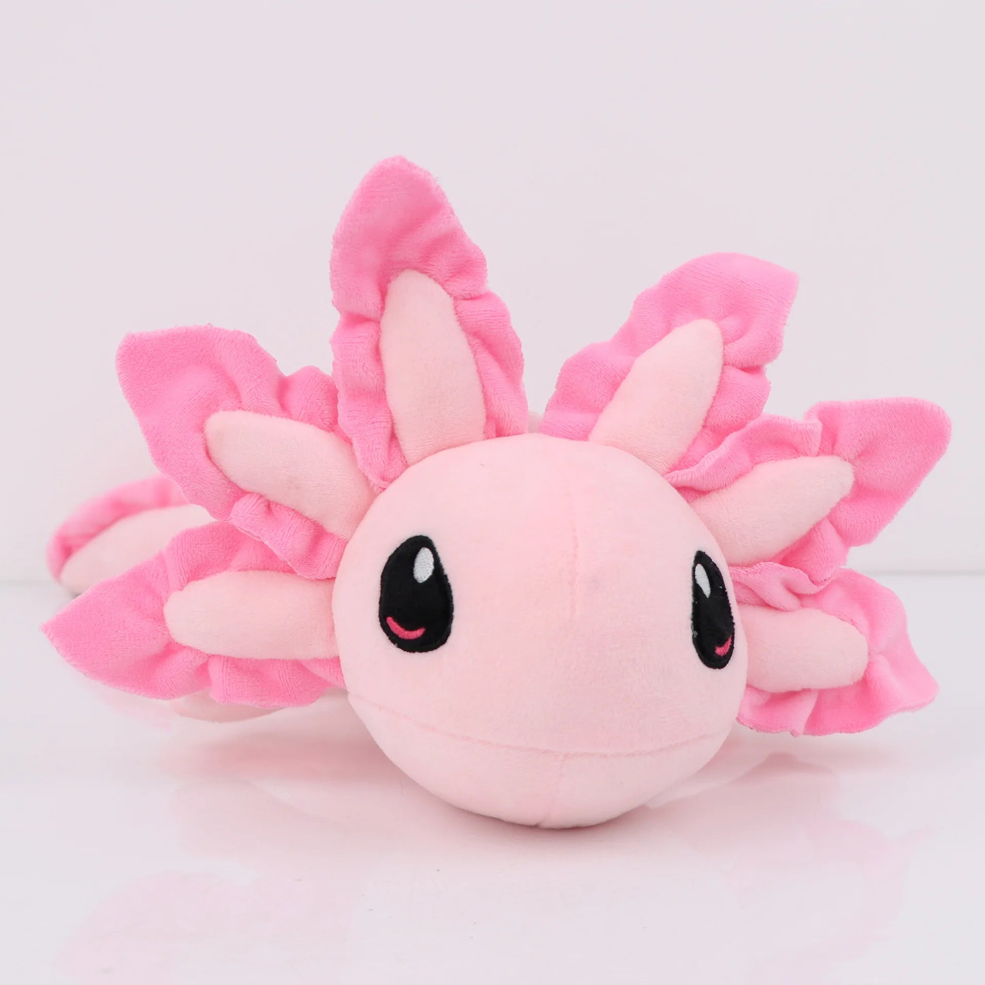 Axolotl Squishmallow Plush Toy – Soft Stuffed Animal Pink axolotl plush toy on a light pink background
