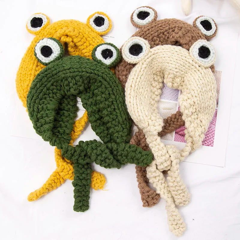 Cute Green Frog Crochet Beanie Hat – Knitted Winter Costume Cap Four crocheted frog toys in yellow, green, brown, and beige on a white background.