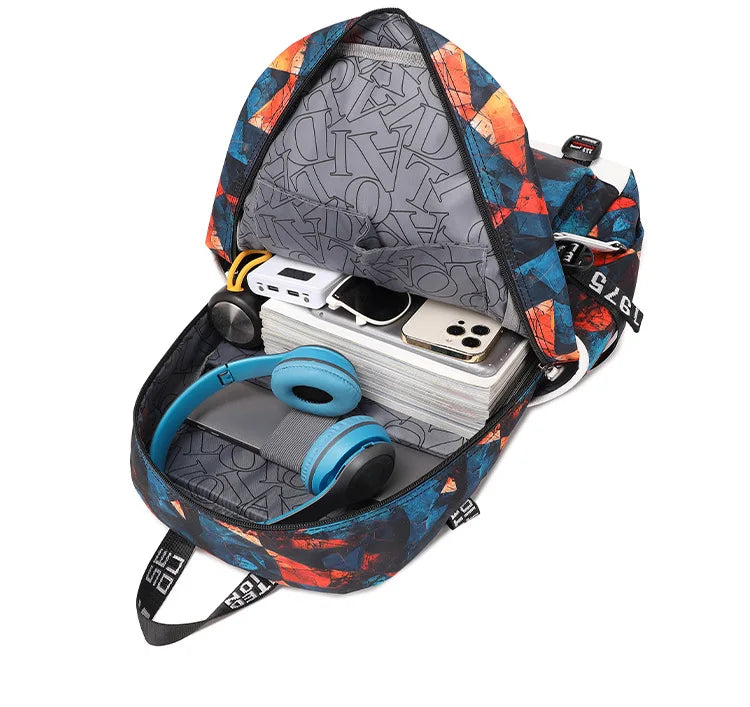 Capybara Backpack – Large Capacity Lightweight School Bag A multicolor patterned backpack shown open, filled with headphones, a laptop, books, and a phone, on a white background.