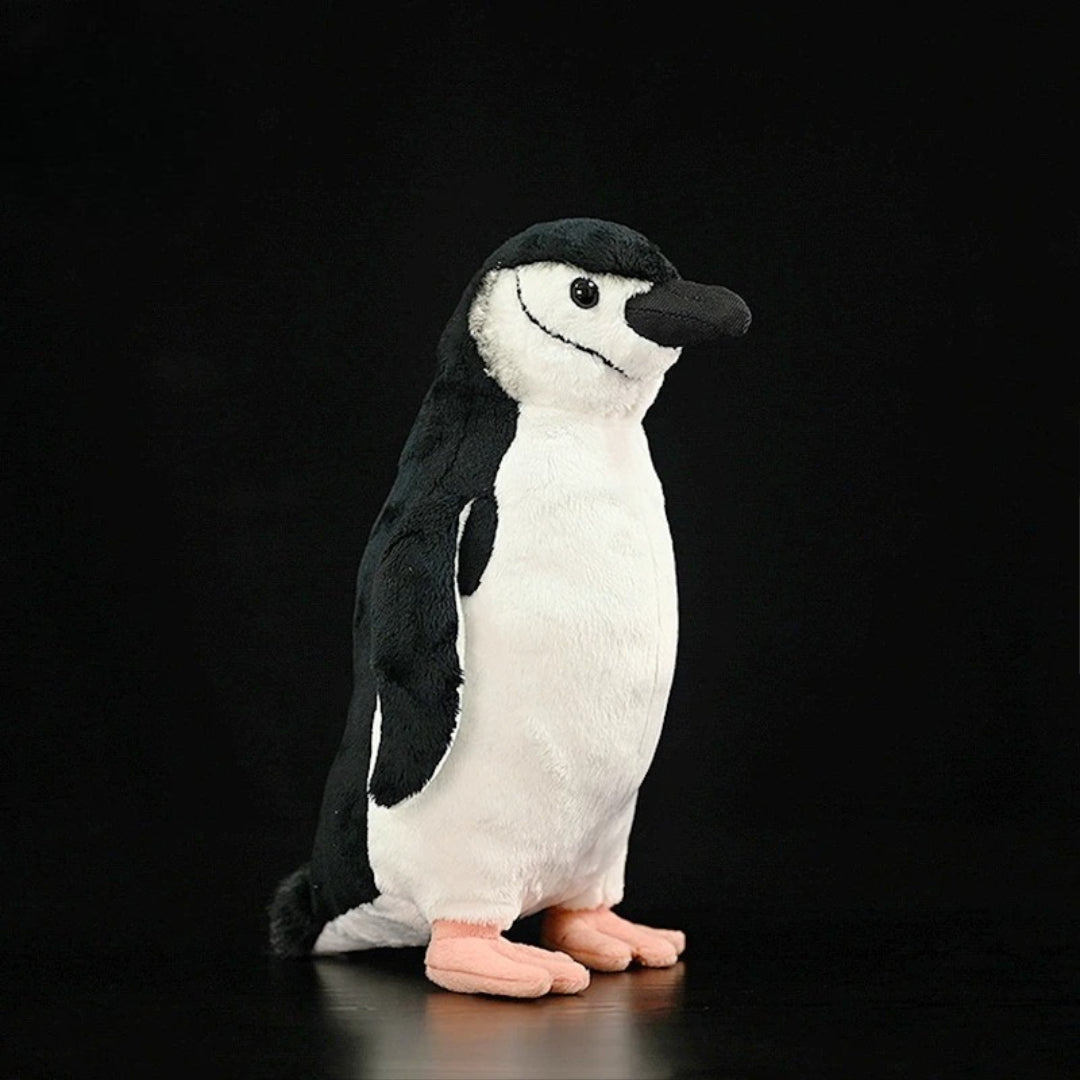 Realistic Penguin Plush Toy - Adélie Penguin Stuffed Animal Plush penguin toy on a black background