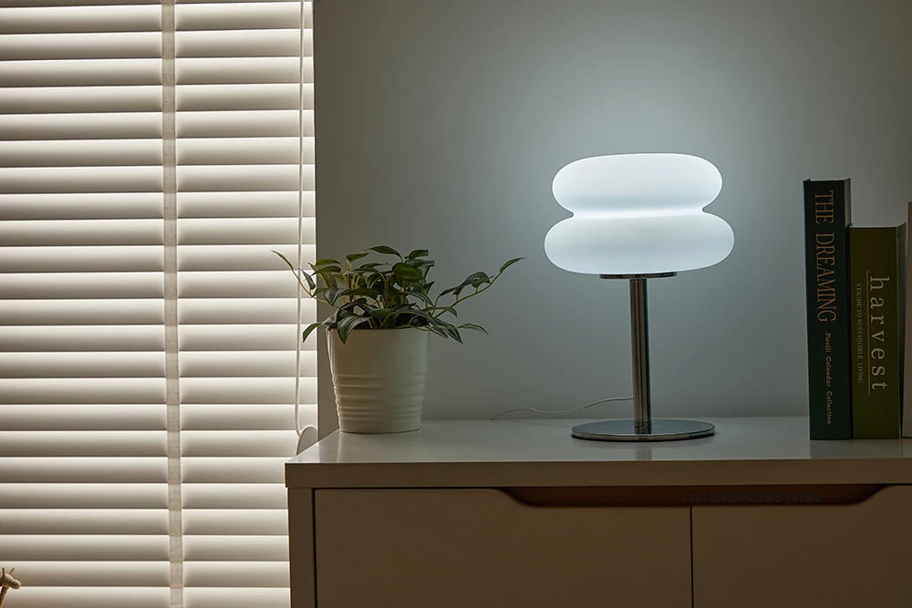 Orange Mushroom Bedside Table Lamp – USB Tri-Color Dimmable Light Modern table lamp on a wooden surface with a plant and book in the background