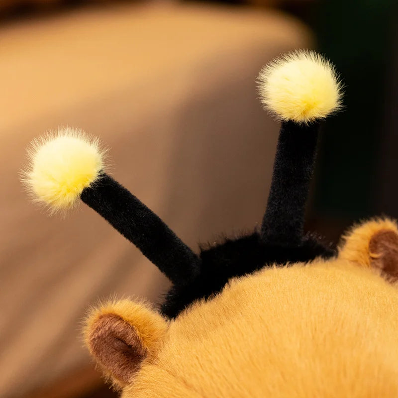 Bee Capybara Plush Toy – Kawaii Soft Stuffed Animal Close-up of a plush bee with yellow fuzzy feelers on a blurred background