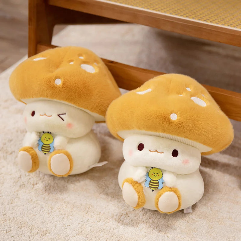 Creative Mushroom Plush Pillow – Cute Stuffed Plant Cushion for Home Décor Two plush mushroom toys with cartoon faces on a soft surface.
