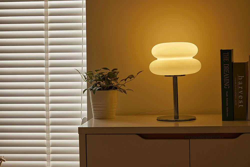 Orange Mushroom Bedside Table Lamp – USB Tri-Color Dimmable Light Modern table lamp on a wooden surface with a plant and book in the background