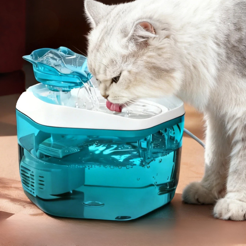 Cat Water Fountain 1.2L USB Pet Drinking Fountain Cat drinking water from a blue pet fountain on a wooden floor.