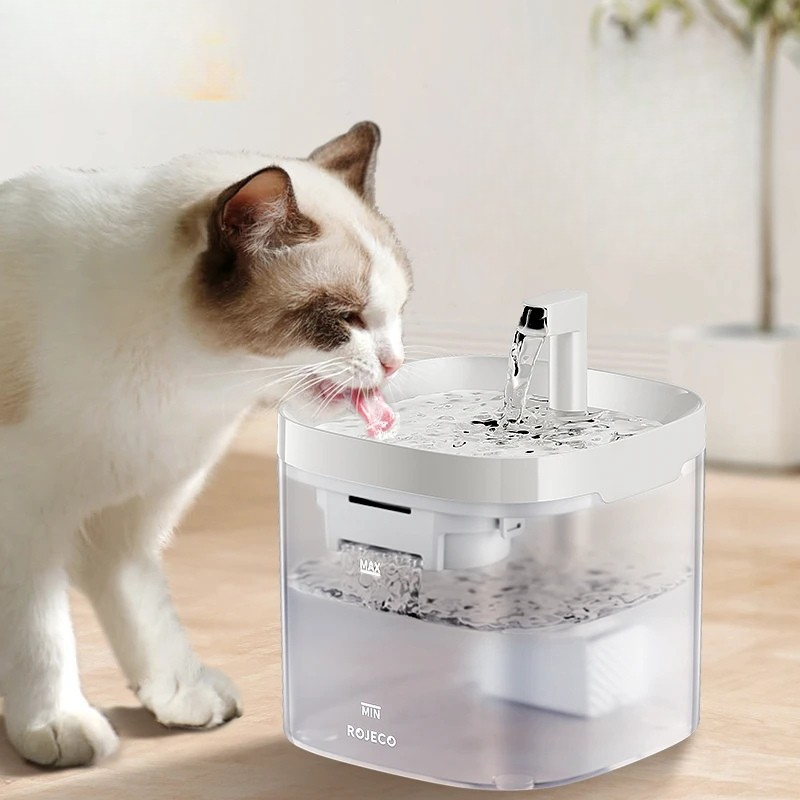Smart Cat Water Fountain Automatic Filter Pet Dispenser Cat drinking water from a pet fountain on a wooden floor.