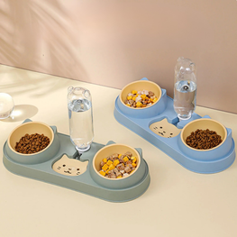 Pet feeding station with bowls and water bottles on a beige surface