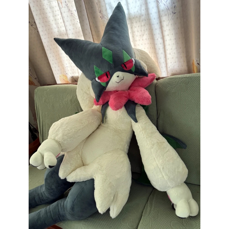 Pokemon Meowscarada Plush Pillow Stuffed Toy A large plush toy of a dark gray and cream-colored Pokémon character with green markings, red eyes, and a pink collar, posed sitting on a green couch in front of patterned curtains.