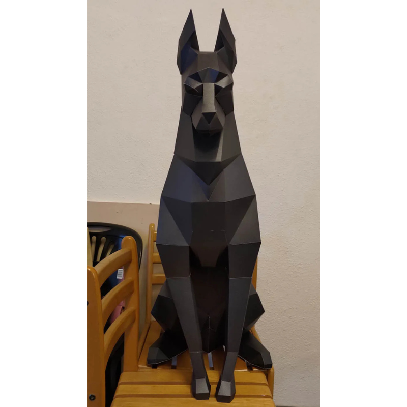 Doberman 3D Paper Model – DIY Animal Papercraft Room Decor Black geometric dog sculpture on a wooden table against a beige wall
