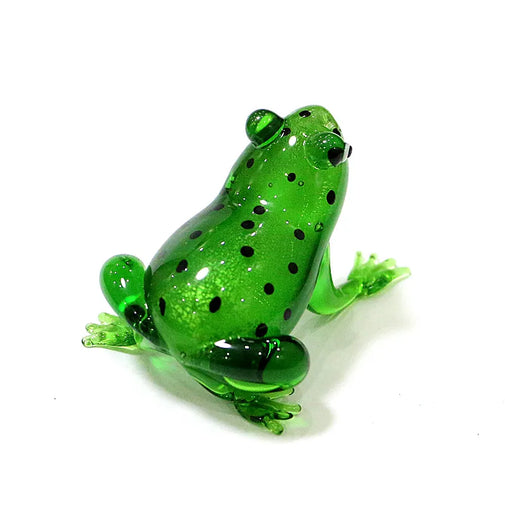 Green glass frog figurine on a white background