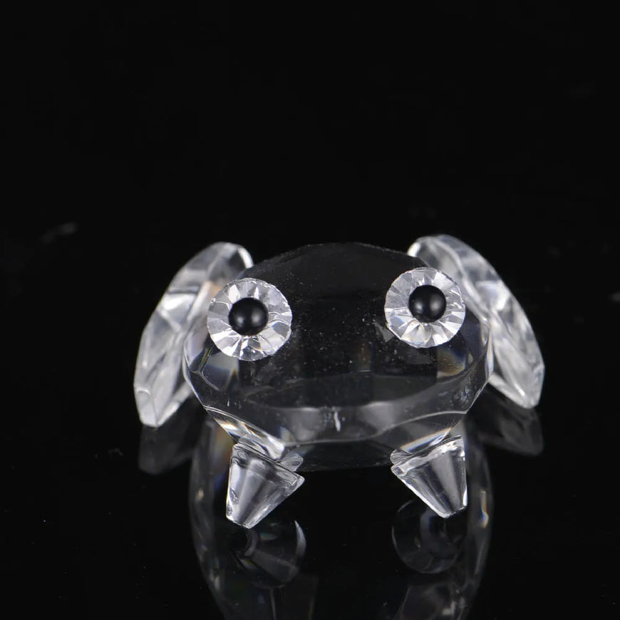 Crystal dog figurine with black eyes on a black background